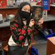 Chloe Gong poses with a copy of her best-selling 2020 debut, These Violent Delights.